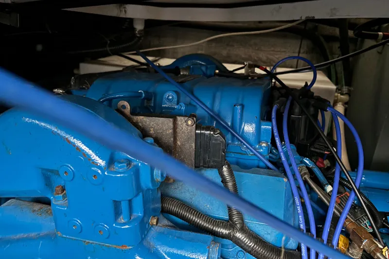 Slide: The Image of 1998 Silverton 360 Express cabin interior with plush bedding and ambient lighting. - 23