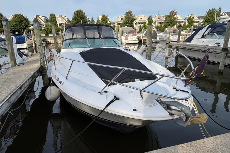 Slide: The Image of 1998 Silverton 360 Express helm with navigation instruments and steering wheel. - 3