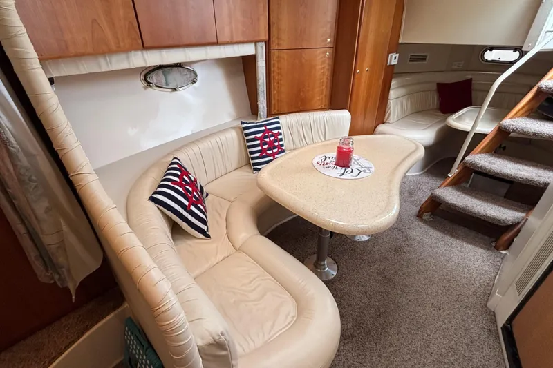 Slide: The Image of 1998 Silverton 360 Express docked at marina, surrounded by other boats and waterfront homes. - 30