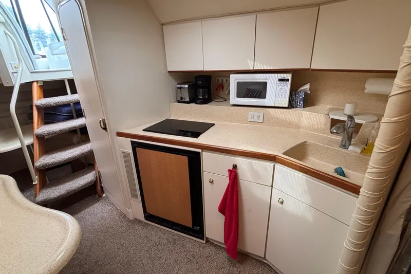 Slide: The Image of 1998 Silverton 360 Express docked at a marina, featuring sleek design and covered cockpit. - 31