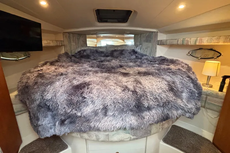 Slide: The Image of 1998 Silverton 360 Express docked at marina, surrounded by other boats and waterfront homes. - 34