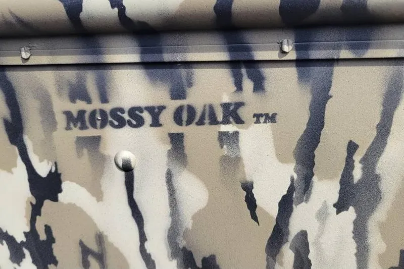 Slide: The Image of Camouflage pattern on 2025 Smoker Craft Jon Boat 1448 with Mossy Oak branding. - 3