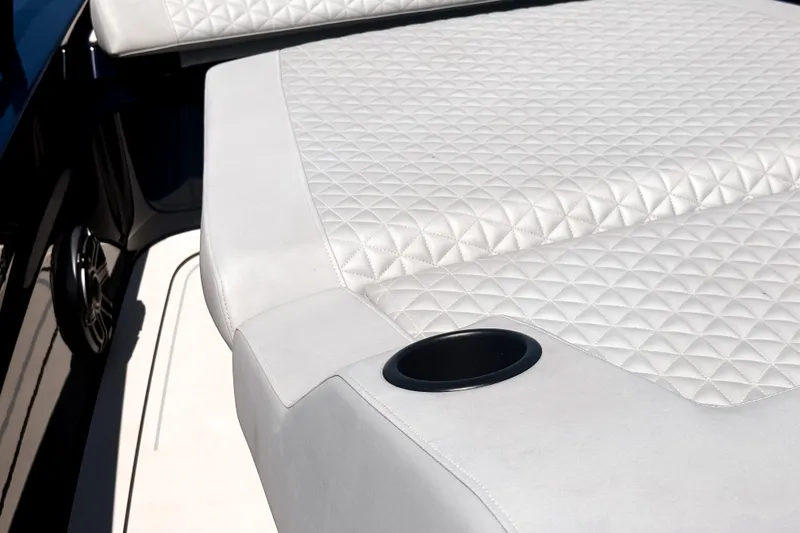Slide: The Image of The image shows luxurious white upholstery with a cup holder. - 40