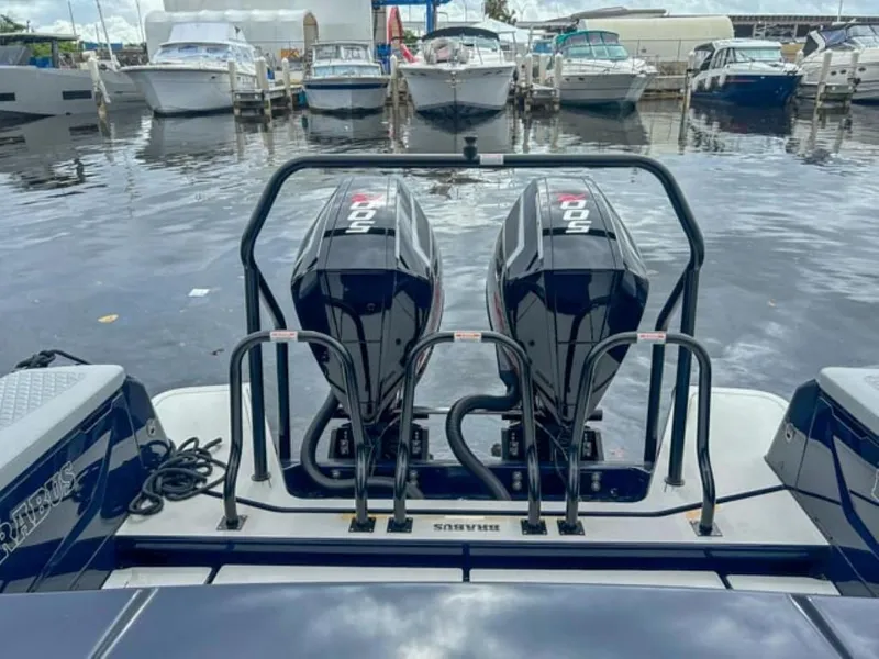 Slide: The Image of 2024 BRABUS Shadow 1000 ST boat with twin outboard engines docked at marina. - 18