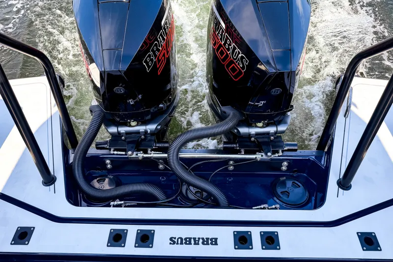 Slide: The Image of Two powerful BRABUS outboard engines on a boat moving through the water. - 12