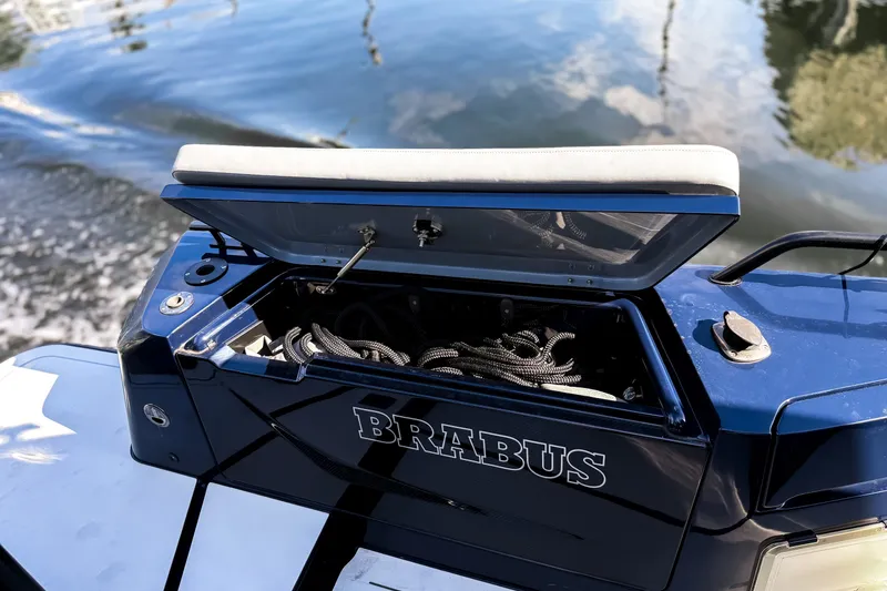 Slide: The Image of The image shows a blue storage compartment on a BRABUS Shadow 1000 ST boat. - 14