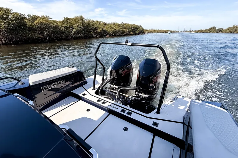 Slide: The Image of The image shows a 2024 BRABUS Shadow 1000 ST boat on a river with two engines. - 8