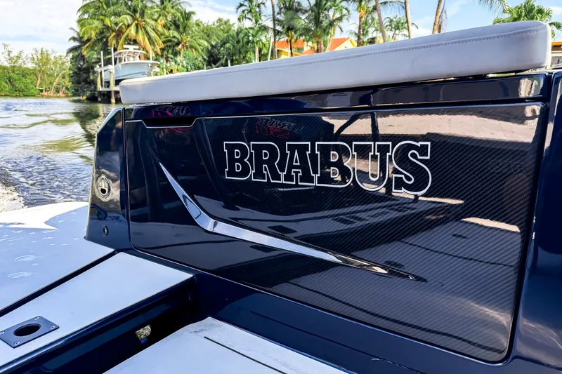 Slide: The Image of The image shows the stern of a 2024 BRABUS Shadow 1000 ST boat with luxurious design. - 13