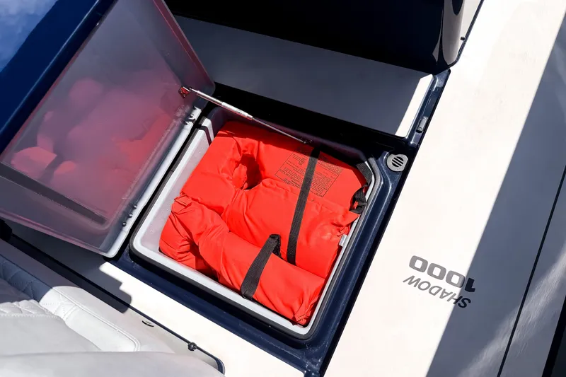 Slide: The Image of A storage compartment on a BRABUS Shadow 1000 ST boat with orange life jackets. - 35