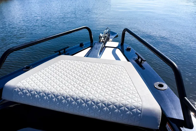 Slide: The Image of The image shows the foredeck of a 2024 BRABUS Shadow 1000 ST with a cushioned seating area. - 38