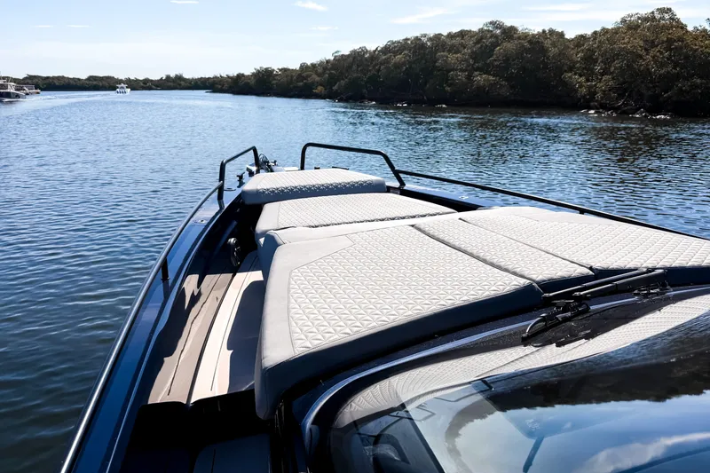 Slide: The Image of The image shows the deck of a 2024 BRABUS Shadow 1000 ST on a calm river. - 36