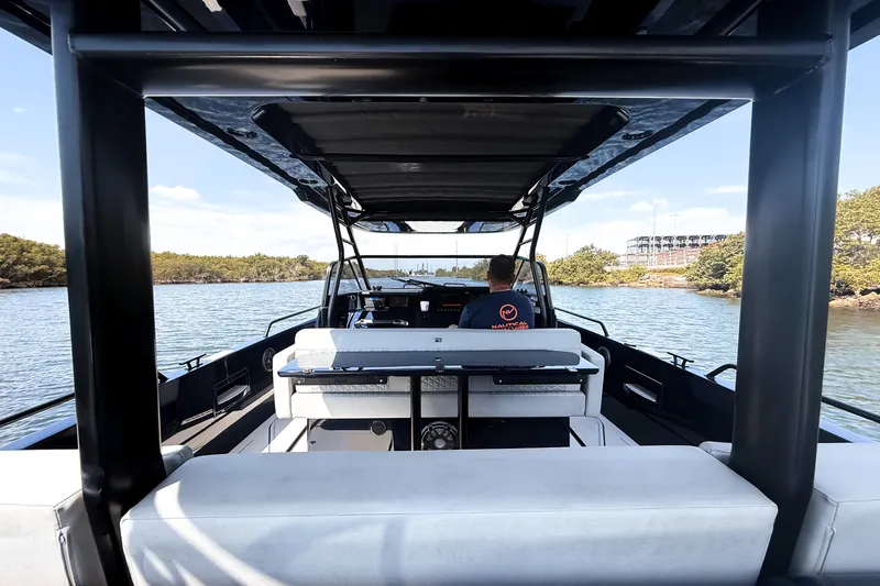 Slide: The Image of The image shows the cockpit of a BRABUS Shadow 1000 ST boat on calm waters. - 25
