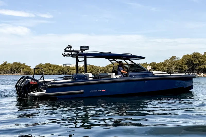 The Image of The image shows a 2024 BRABUS Shadow 1000 ST boat on calm water. - 0