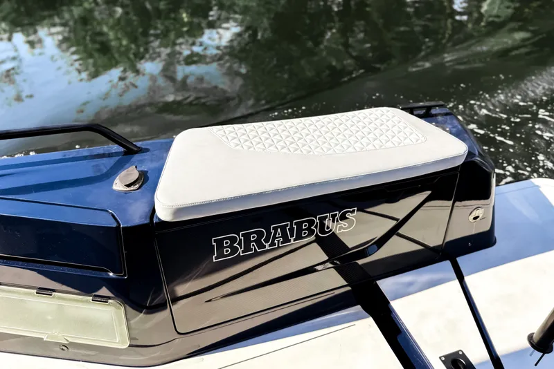 Slide: The Image of The 2024 BRABUS Shadow 1000 ST features a sleek design with a cushioned seat and glossy finish. - 15