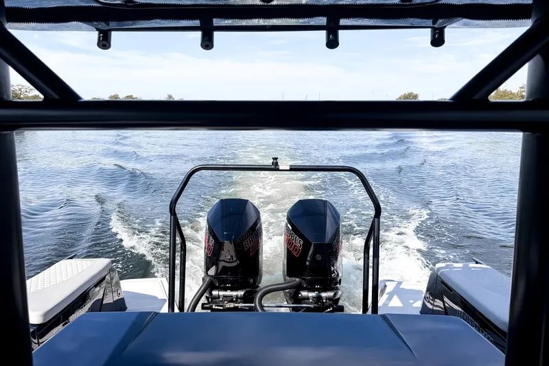 Slide: The Image of The image shows the stern of a BRABUS Shadow 1000 ST with two powerful outboard engines on the water. - 10