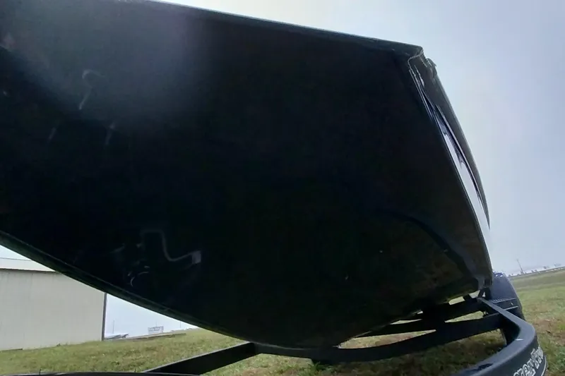 Slide: The Image of 2024 Ranger RT198P boat hull on trailer, outdoor setting. - 11