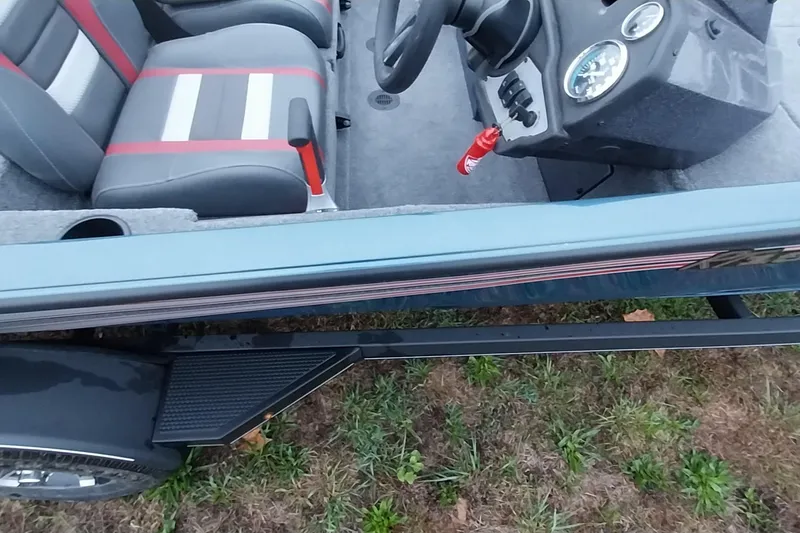 Slide: The Image of 2024 Ranger RT198P boat interior with steering console and dual seats. - 22