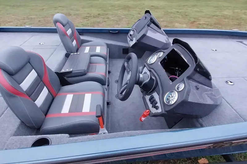 Slide: The Image of 2024 Ranger RT198P boat interior with dual seats and modern dashboard. - 23