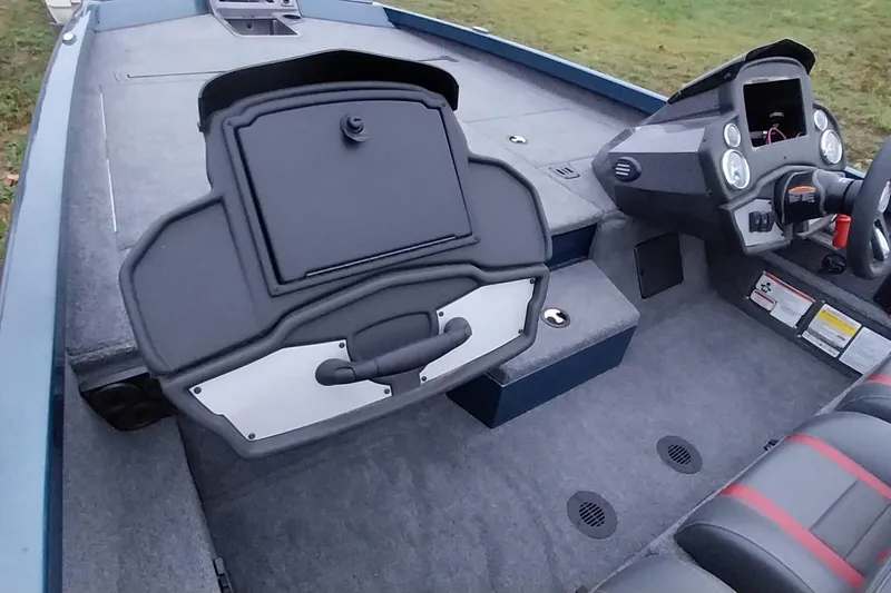Slide: The Image of 2024 Ranger RT198P boat interior with steering console and storage compartments. - 3
