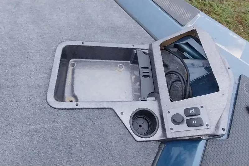 Slide: The Image of 2024 Ranger RT198P boat console with storage compartment and control buttons. - 36