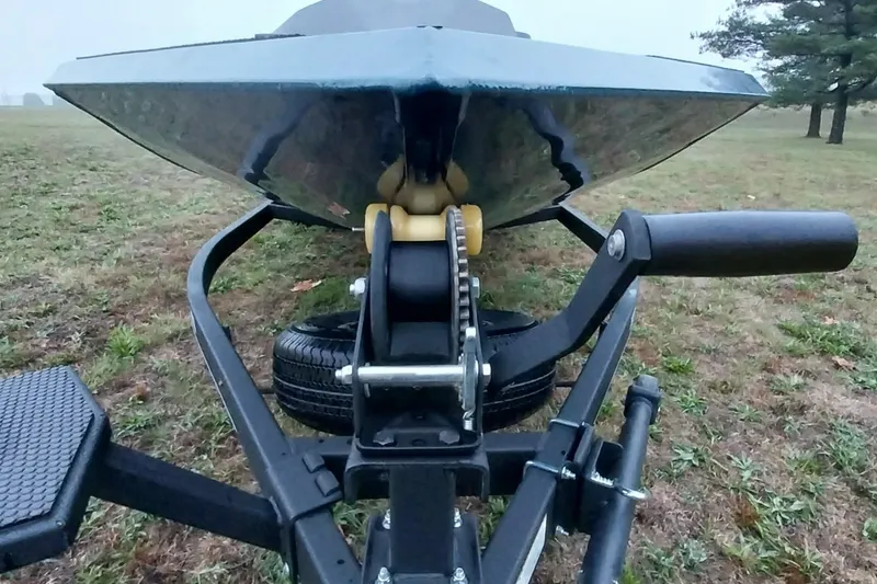 Slide: The Image of 2024 Ranger RT198P boat trailer close-up on grassy field. - 37