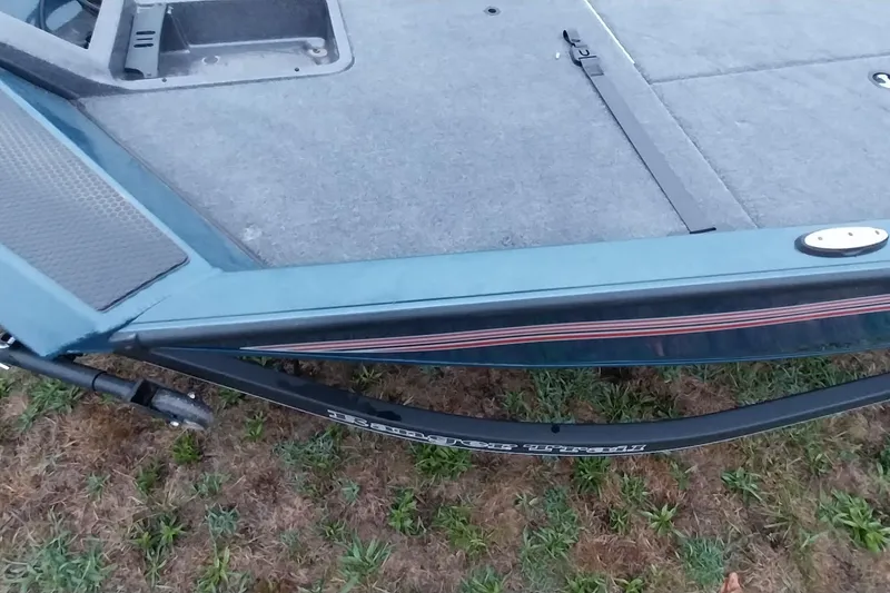 Slide: The Image of 2024 Ranger RT198P boat deck and trailer on grass. - 41