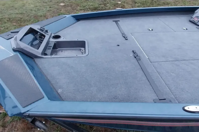 Slide: The Image of 2024 Ranger RT198P boat deck with storage compartments and control panel. - 42