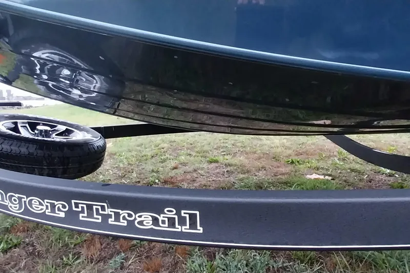 Slide: The Image of 2024 Ranger RT198P boat on trailer, showcasing hull and wheel detail. - 48
