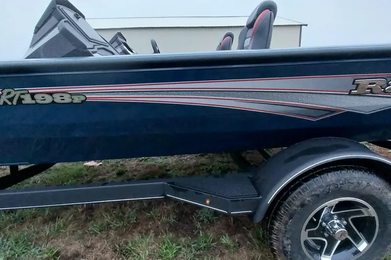 Slide: The Image of 2024 Ranger RT198P boat with sleek design and modern features on a trailer. - 49