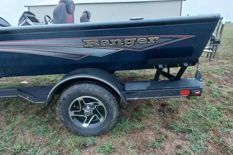 Slide: The Image of 2024 Ranger RT198P boat on trailer, showcasing sleek design and logo. - 5