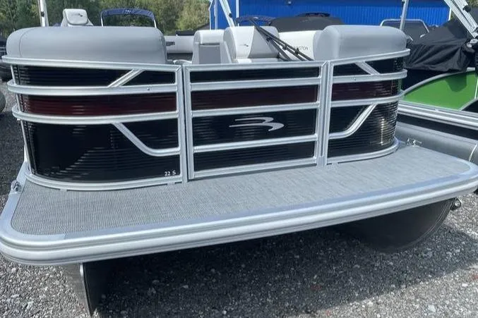 Slide: The Image of 2025 Bennington SLJSR pontoon boat, rear view, sleek design, silver and black accents. - 1