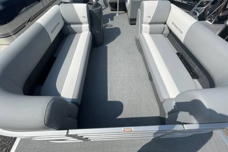 Slide: The Image of 2025 Bennington SLJSR pontoon boat interior with gray seating and spacious layout. - 11
