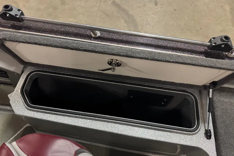Slide: The Image of Open storage compartment in 2018 Ranger 621FS Fisherman boat, featuring secure latch and durable interior. - 13
