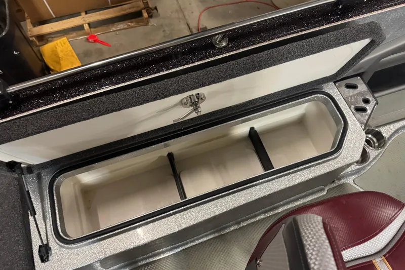 Slide: The Image of Open storage compartment in 2018 Ranger 621FS Fisherman boat, featuring a spacious interior. - 14