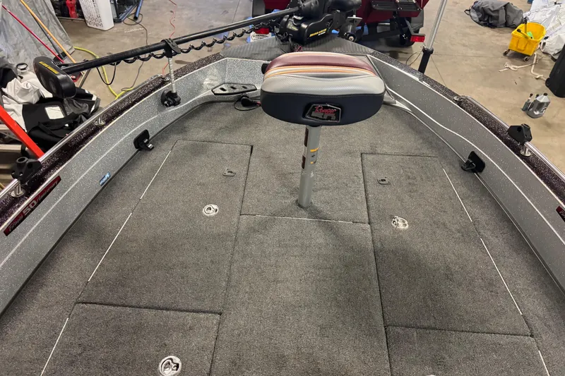 Slide: The Image of 2018 Ranger 621FS Fisherman boat interior with fishing seat and carpeted deck. - 15