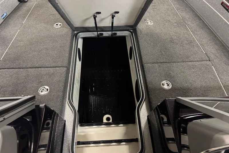 Slide: The Image of 2018 Ranger 621FS Fisherman boat interior with open storage compartment. - 16