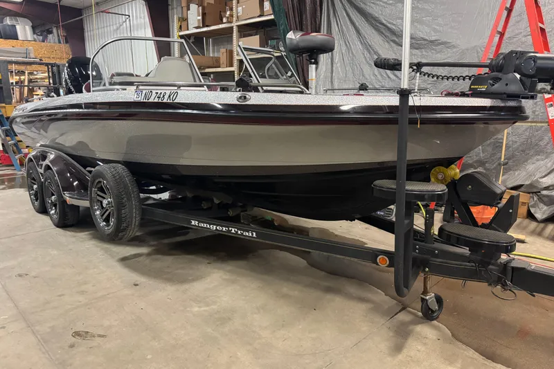 Slide: The Image of 2018 Ranger 621FS Fisherman boat on trailer in a garage setting. - 2