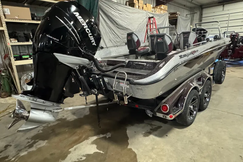 Slide: The Image of 2018 Ranger 621FS Fisherman boat with Mercury outboard motor in a garage setting. - 3