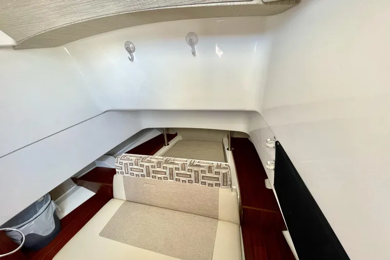 Slide: The Image of Interior cabin of 2023 Pursuit S 328 Sport boat with modern seating and decor. - 16