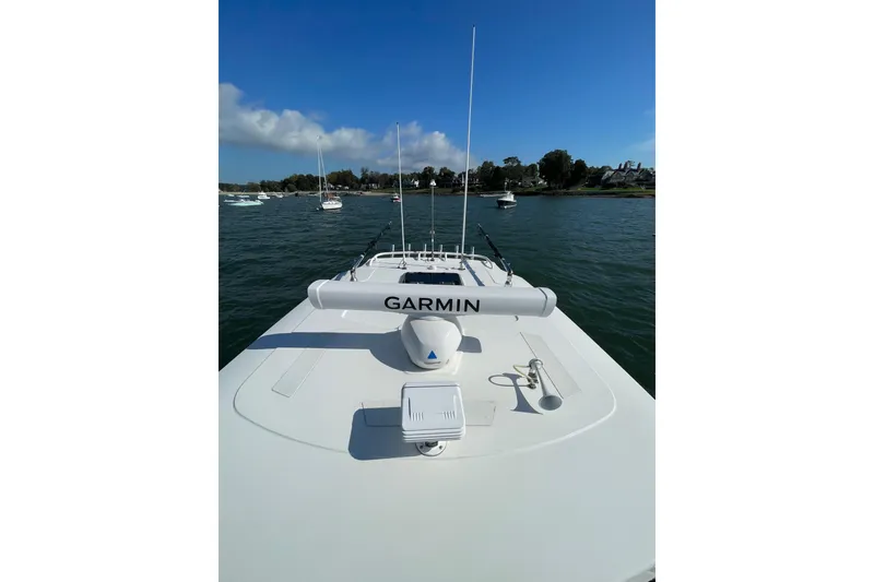 Slide: The Image of 2023 Pursuit S 328 Sport boat with Garmin equipment on open water. - 22