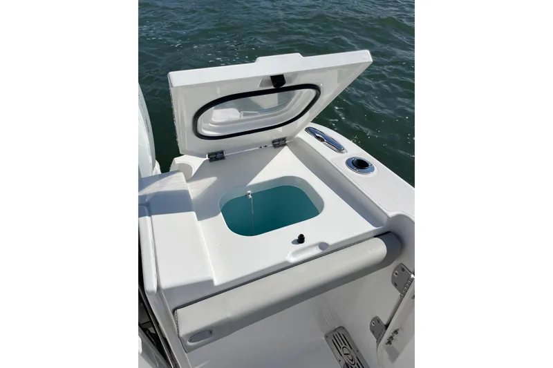 Slide: The Image of 2023 Pursuit S 328 Sport boat with open livewell on deck. - 30