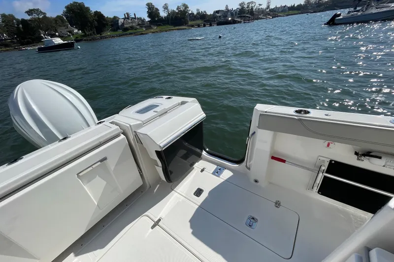 Slide: The Image of 2023 Pursuit S 328 Sport boat interior with open water view. - 35