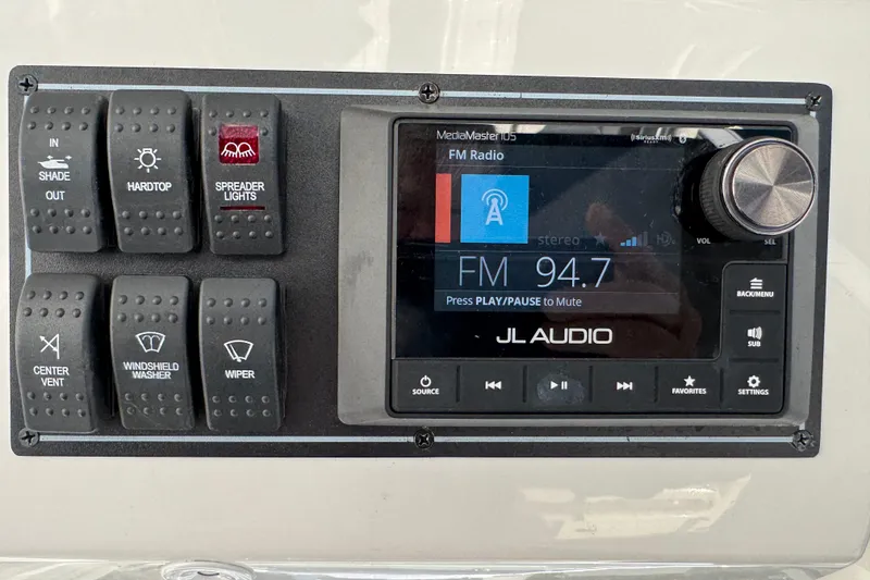 Slide: The Image of Control panel of 2023 Pursuit S 328 Sport boat with JL Audio system. - 8