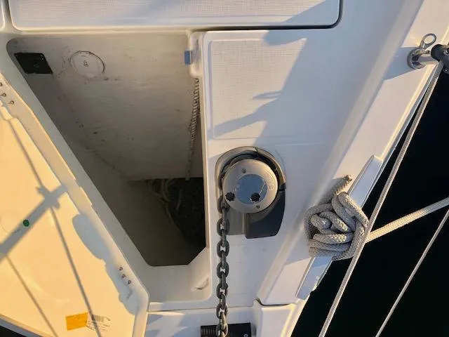 Slide: The Image of Anchor chain and locker on 2023 Beneteau Oceanis 46.1 sailboat deck. - 14