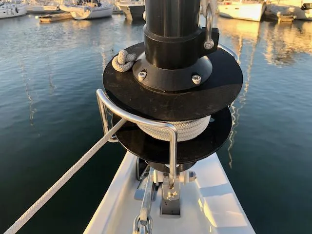 Slide: The Image of 2023 Beneteau Oceanis 46.1 sailboat detail with rope and winch in marina. - 15