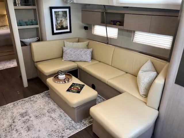 Slide: The Image of Luxurious interior of 2023 Beneteau Oceanis 46.1 yacht with beige seating and modern decor. - 34