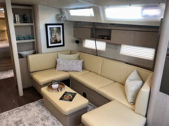 Slide: The Image of Luxurious interior of 2023 Beneteau Oceanis 46.1 yacht with beige seating and modern decor. - 35