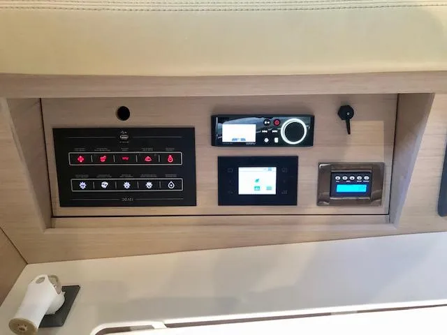 Slide: The Image of Control panel of 2023 Beneteau Oceanis 46.1 yacht, featuring modern navigation and system controls. - 36