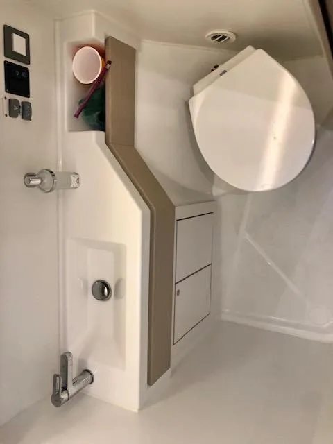 Slide: The Image of Interior of 2023 Beneteau Oceanis 46.1 yacht bathroom with modern fixtures. - 41