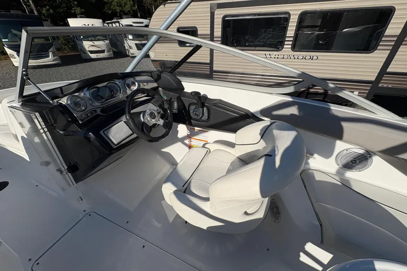 Slide: The Image of 2010 Sea-Doo 210 Challenger SE boat interior with steering wheel and dashboard. - 10